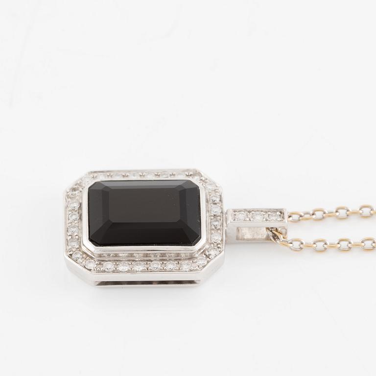 Pendant in 18K white gold set with brilliant-cut diamonds and likely onyx, with chain.