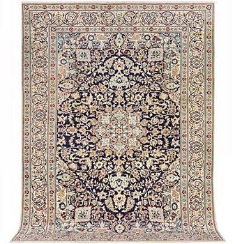 A Nain carpet, part silk, c. 338 x 244 cm.