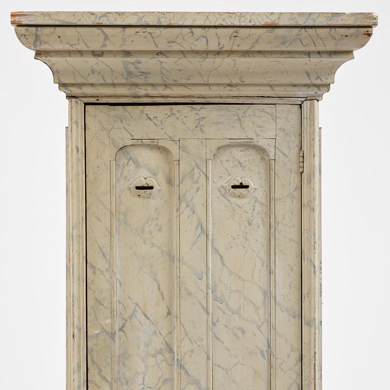 A Swedish column-shaped cabinet 19 th century.