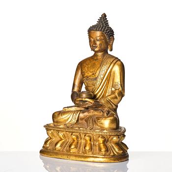 A gilt-bronze figure of Amitabha Buddha, Tibet, 17/18th century.