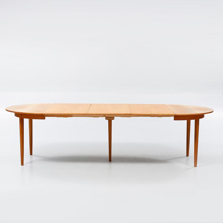 A dining table designed by Carl Malmsten and named "Calmare Nyckel".