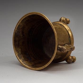 A gilt copper alloy tripod censer, Qing dynasty, presumably 18th Century with Xuandes six character mark.