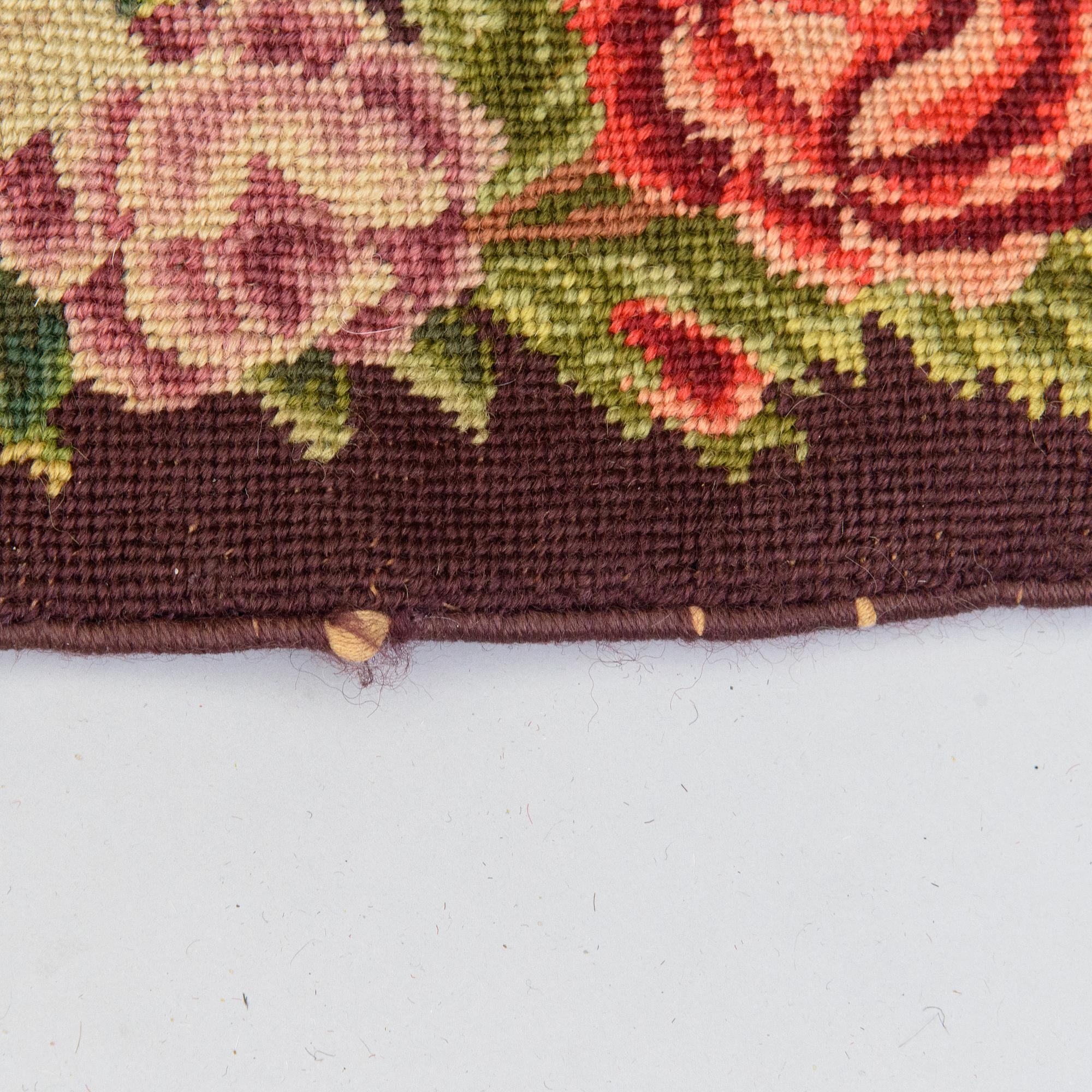 An embroided carpet, 1850-1900. Circa 195 x 130 cm.