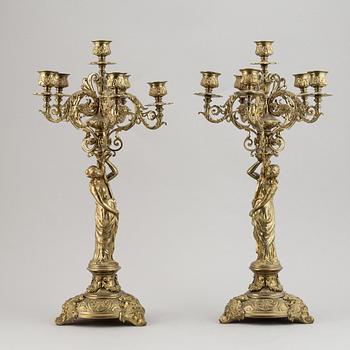 A pair of late 19th century brass candelabra for six candles.