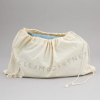 STELLA MCCARTNEY, a denim handbag.