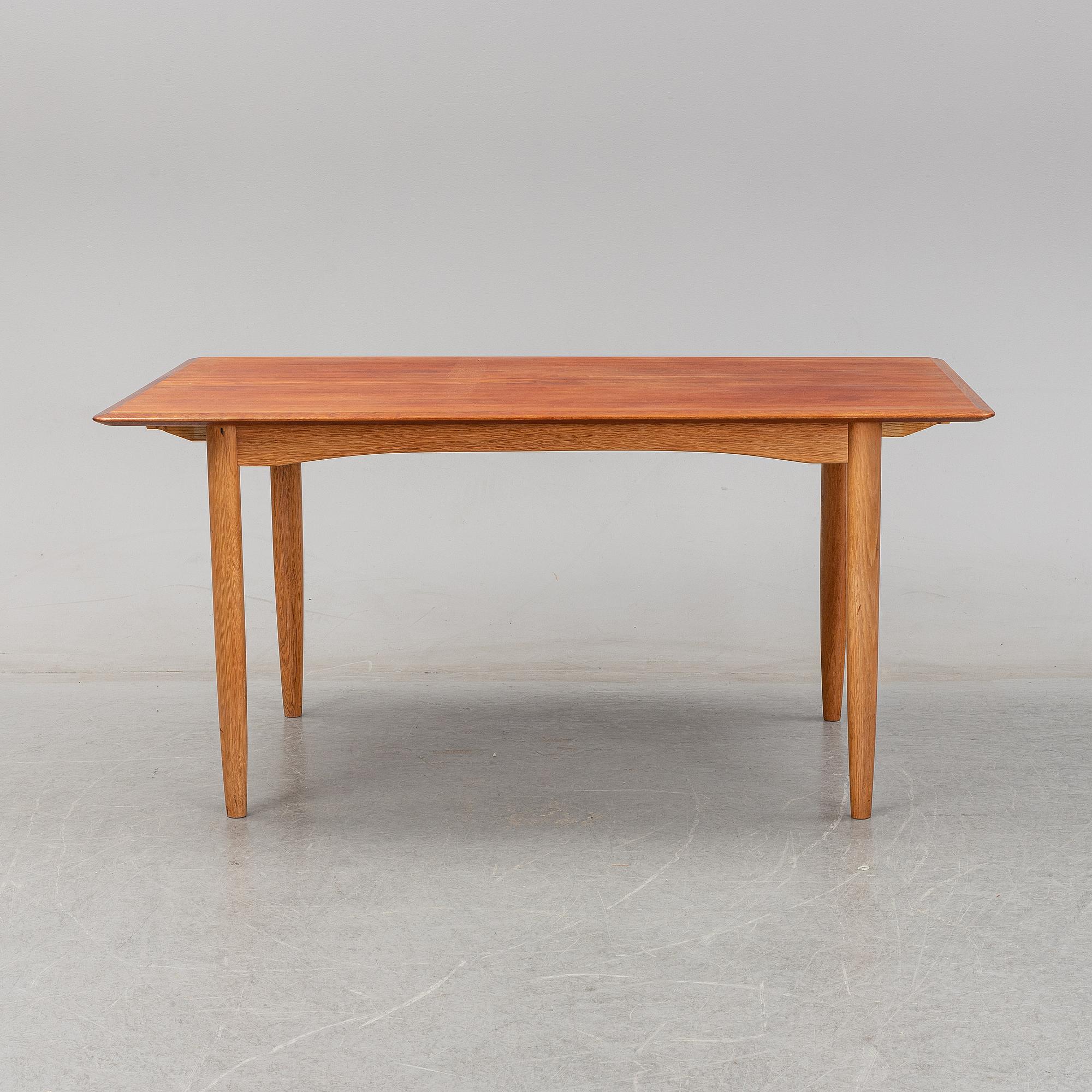 A 1950/60's dining table from Slagelse Møbelvaerk A/S with two additional leaves.