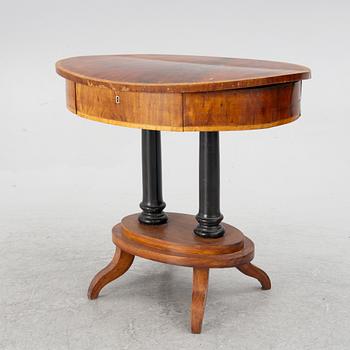 An Empire sewing table, mid-19th Century.