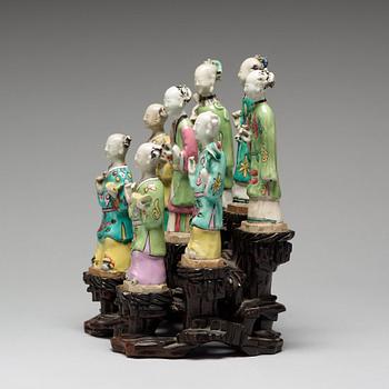 A group of eight famille rose figurines, Qing dynasty, 19th Century.