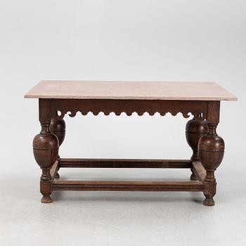 A Baroque oak and stone top table, 18th Century.