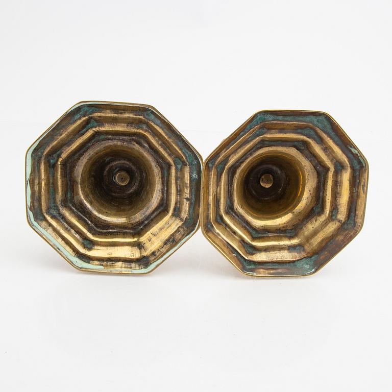 A pair of 18th century brass candle sticks.