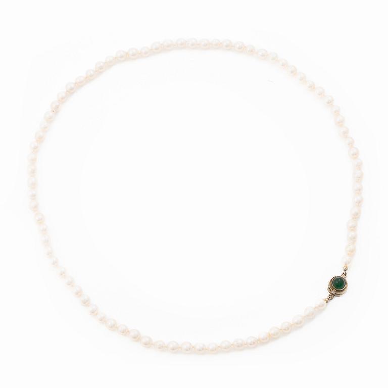 Cultured pearl necklace with Niels Erik From clasp, Denmark, silver set with a green cabochon-cut stone.