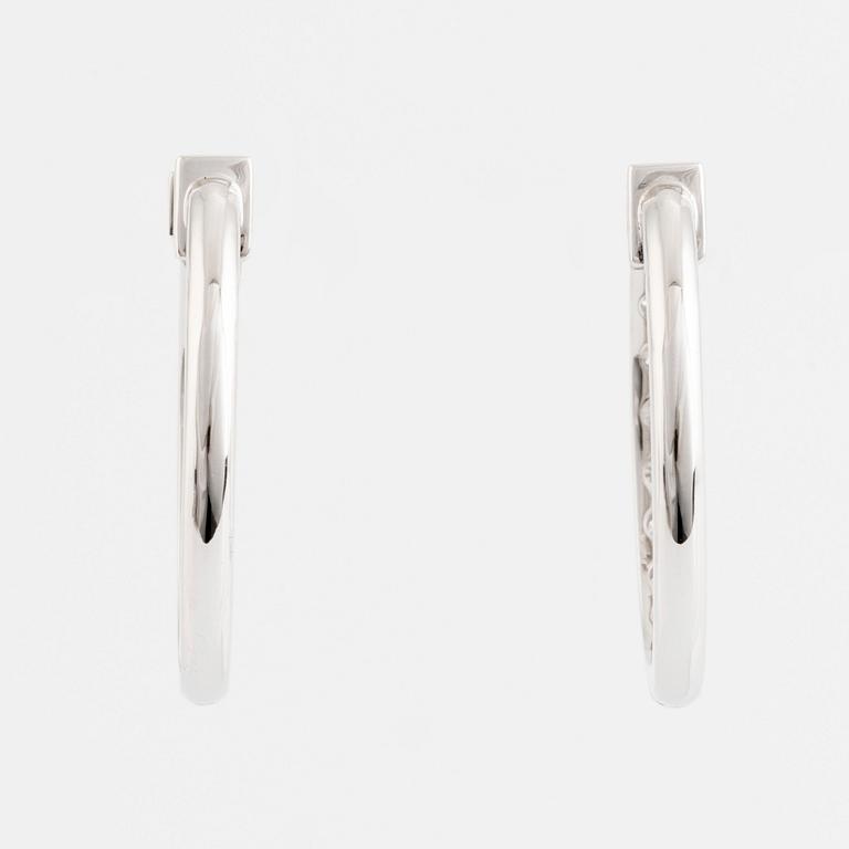 Brilliant cut diamond hoop earrings.