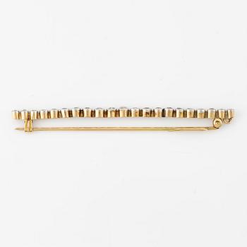 A brooch/pendant, pin, gold and platinum set with old-cut diamonds.