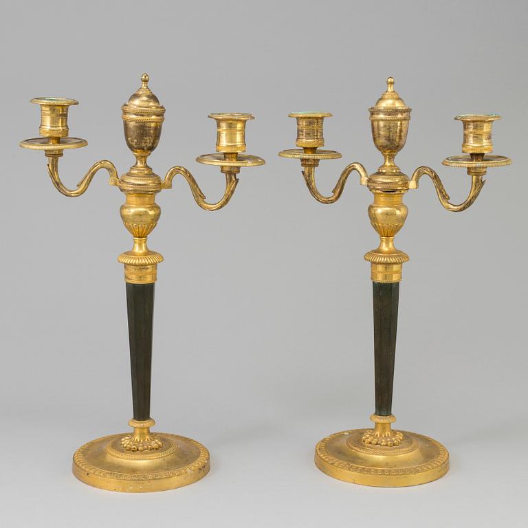 A pair of French Directoire late 18th century ormolu candelabra for three candles.