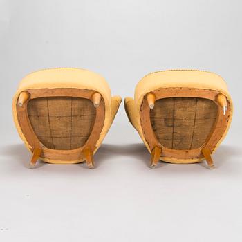 A pair of mid-20th century armchairs.