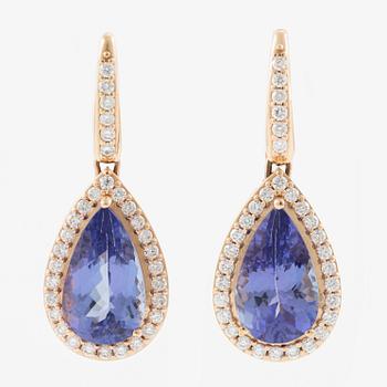 A pair of 18K gold earrings with faceted tanzanites and round brilliant-cut diamonds.