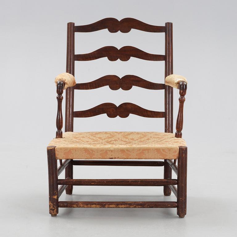 A Swedish Royal "Gripsholm" armchair.