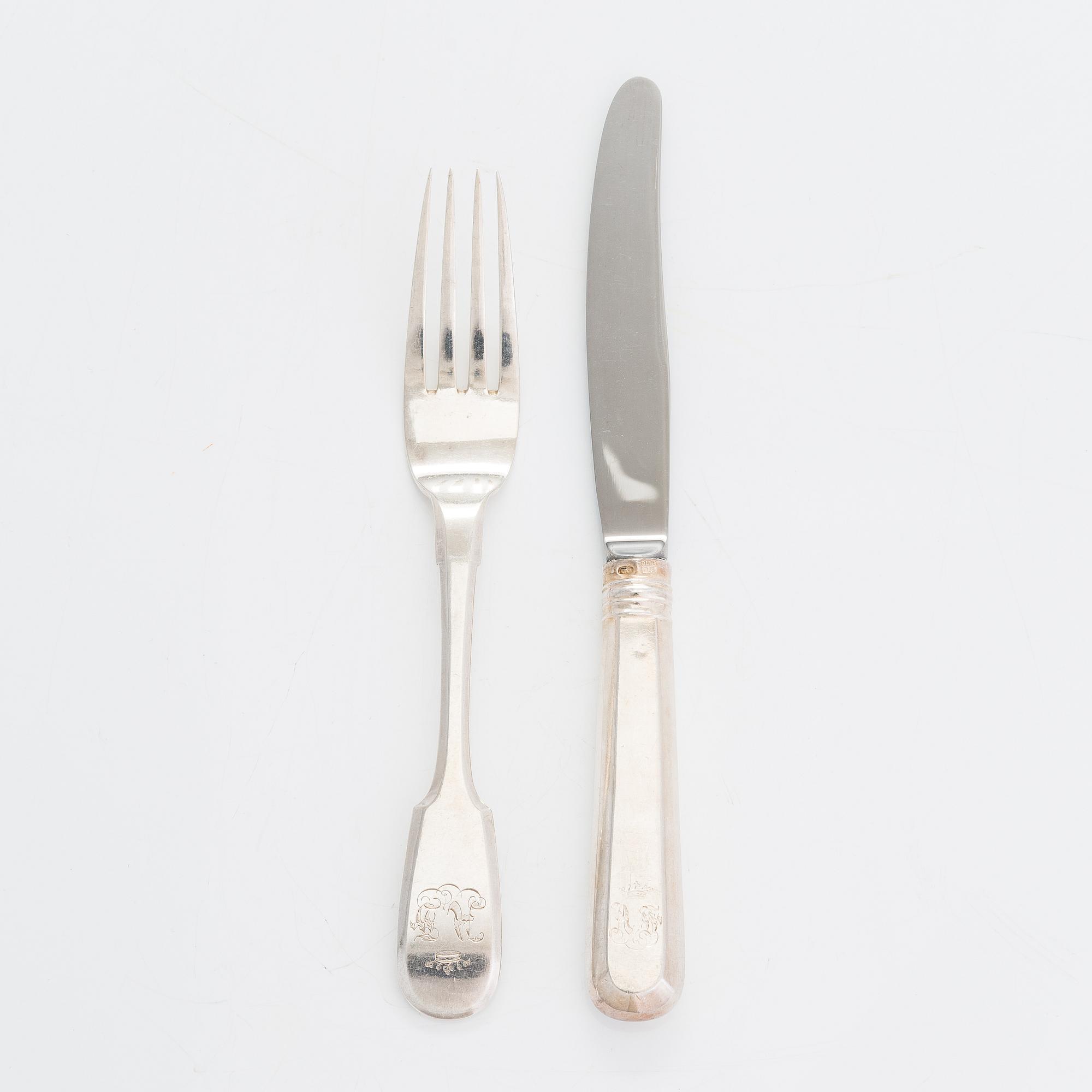 A 24-piece set of silver cutlery, Saint Petersburg 1870. Maker's mark A.K.