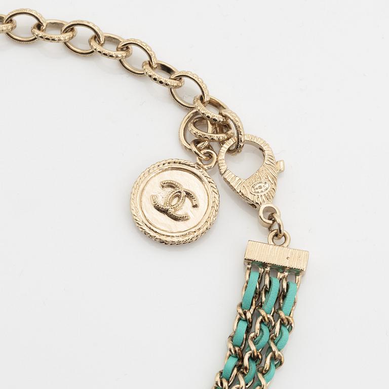 Chanel, a silver tone pearl and leather necklace.