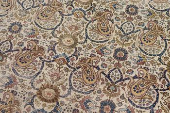 A Tabriz carpet, semi-antique, c. 330 x 230 cm.