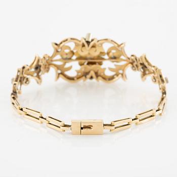 Necklace and bracelet in with floral motif set with cabochon-cut emeralds and rose-cut diamonds.