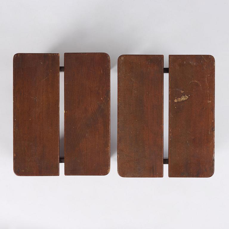 Axel Einar Hjorth, a pair of stained pine "Skoga" stools, Nordiska Kompaniet, Sweden, 1930s.