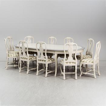 One dinner table and ten chairs, Rococo-style, modern production.