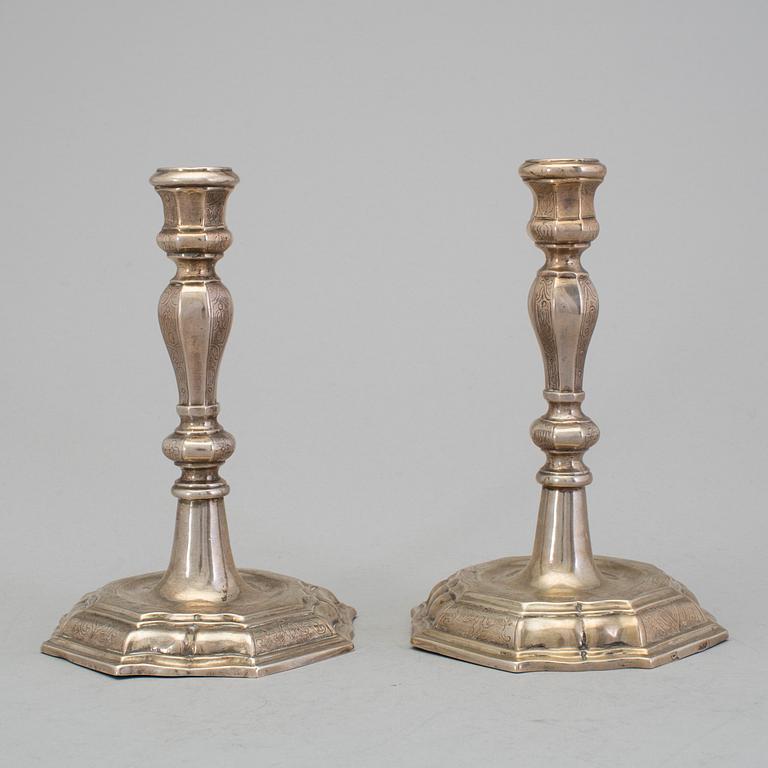 A pair of 18h century silver candlesticks, unidentified marks.