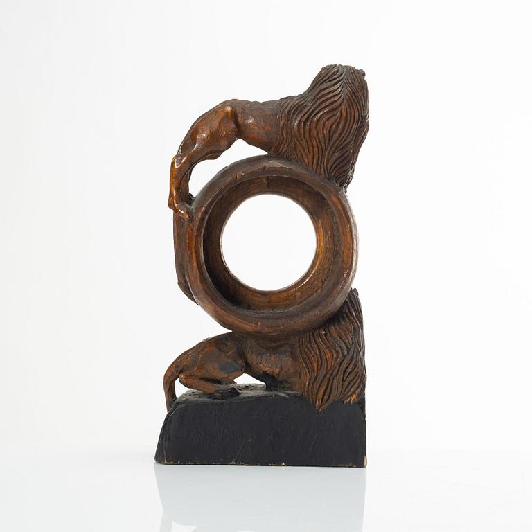 A carved pocket watch stand, Sweden, 19th century.