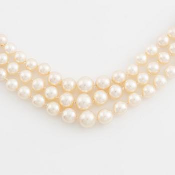Three strand calibrated cultured pearl necklace, clasp with pearl and rose cut diamonds.