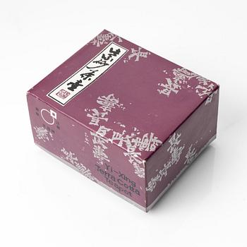 A group of three yixing teapots and a box with cover, China, 1970/80s.