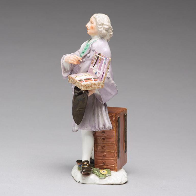 A Meissen porcelain figure of a trinket salesman from the series of Parisian street-traders, circa 1745.