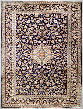 A Keshan rug, signed, 405 x 301 cm.