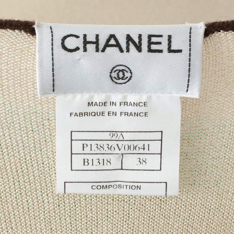 CHANEL, a gold colored and brown sweater set consisting of a sleevles top and cardigan.