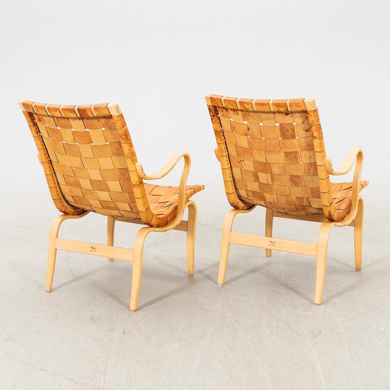 Two 'Eva' easy chairs by Bruno Mathsson for Firma Karl Mathsson dated 1964.