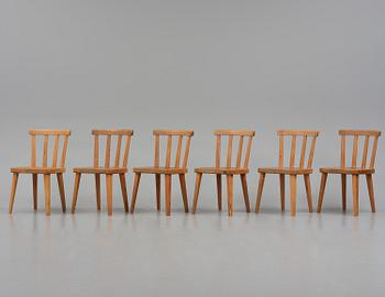 Axel Einar Hjorth, a set of six stained pine "Utö" chairs, Nordiska Kompaniet, Sweden, 1930s.