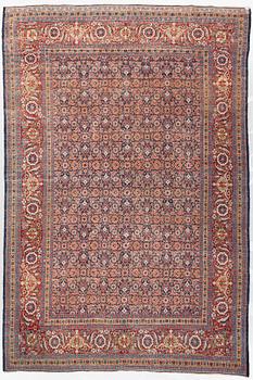 A carpet, a semi-antique Tabriz, ca 357 x 255 cm.