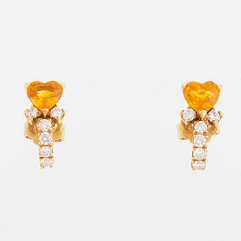 A pair of heart shaped yellow sapphire and brilliant-cut diamond earrings.