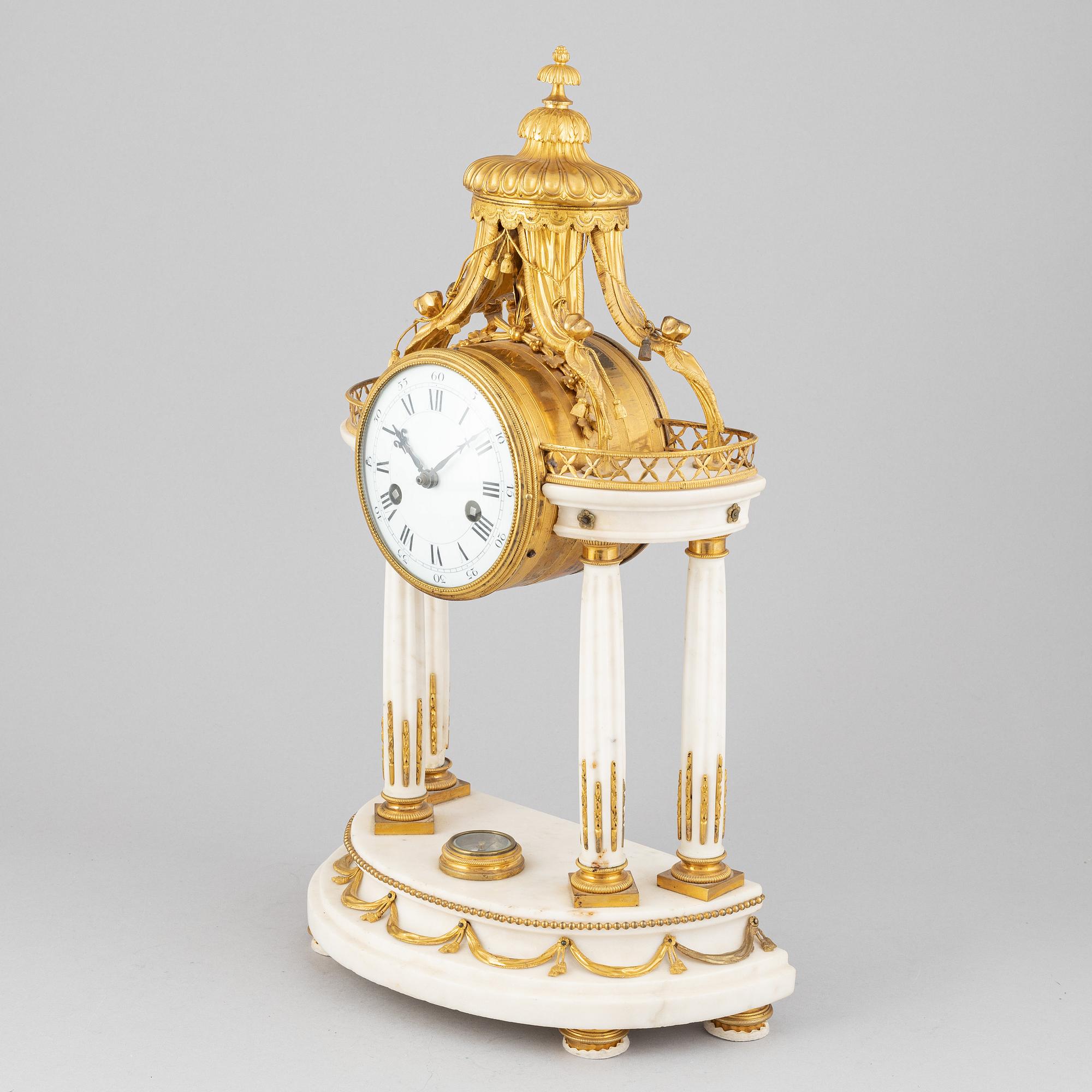 A Louis XVI marble and gilt bronze mantel clock, late 18th Century.