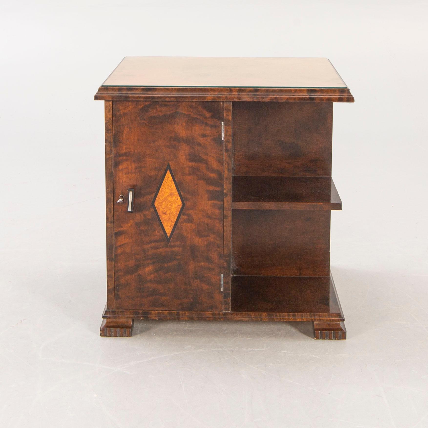 A 1930s birch side table.