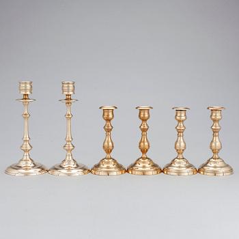 Three pair of candlesticks in brass, marked WMF, Westerås Metallfabrik and NLP. Late 19/early 20th century.