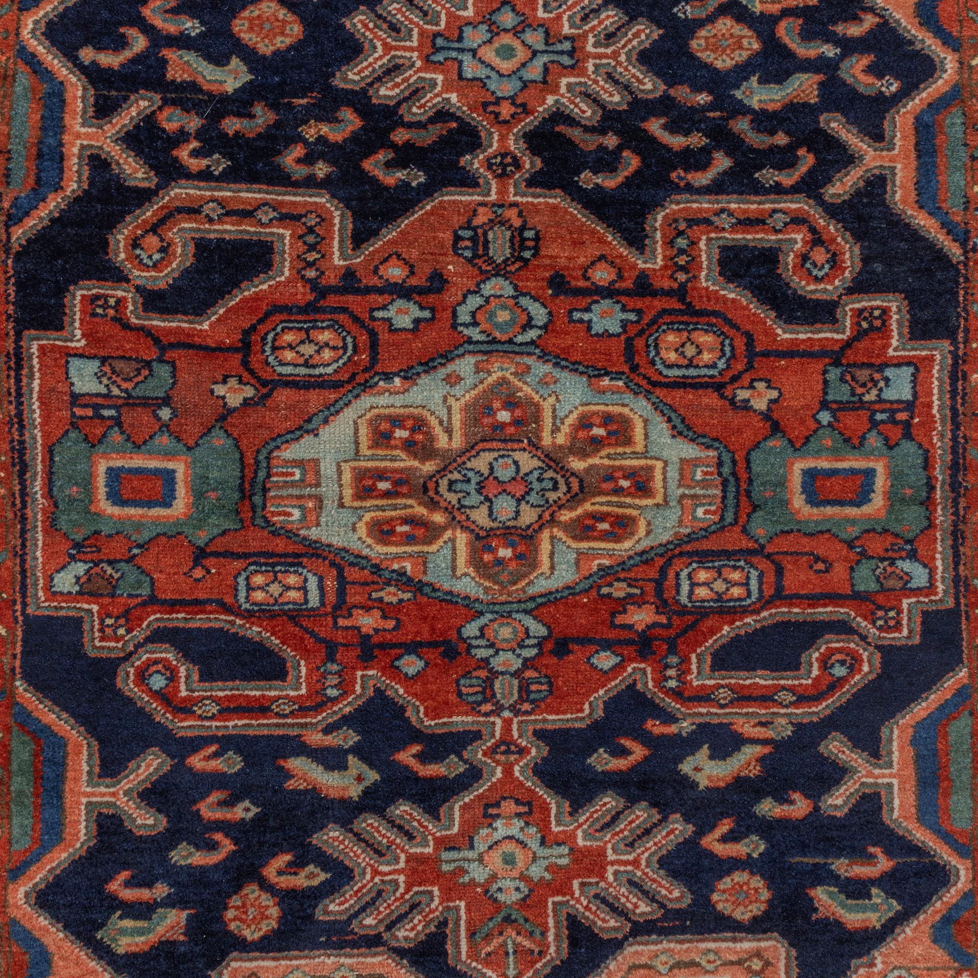 A Heriz rug, c. 192 x 133-139 cm.