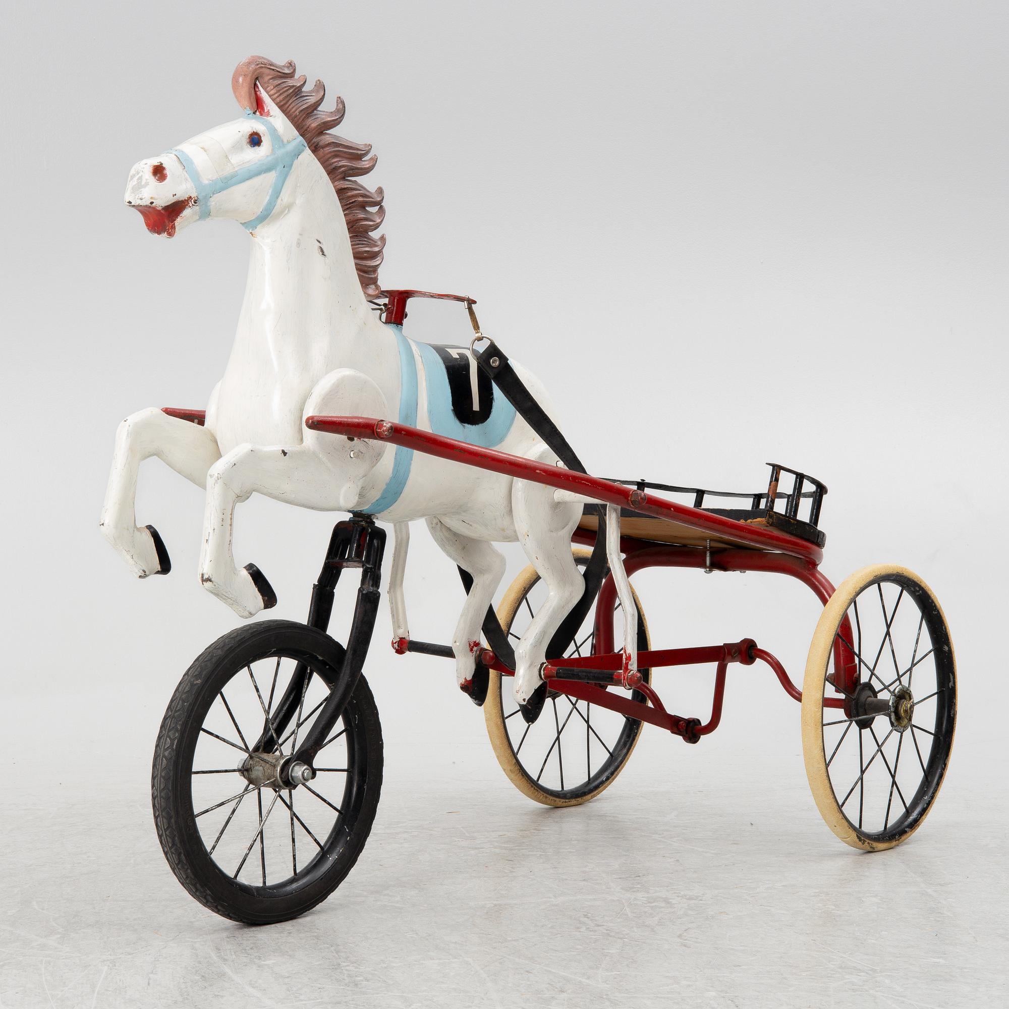 Toy horse with sulky, circa mid-1900s.