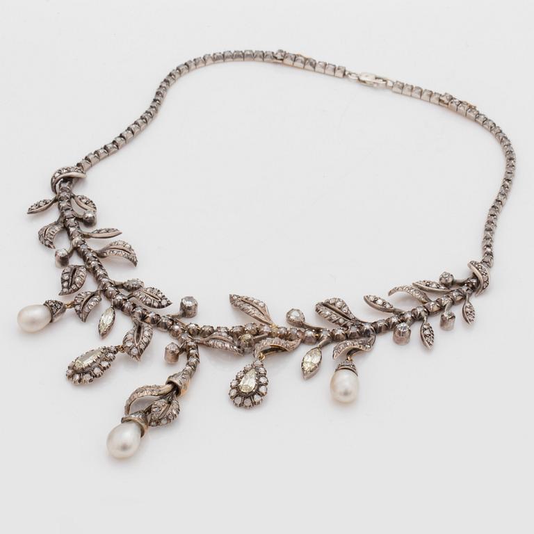 An old-, rose- and pear shaped diamond and probably natural saltwater pearl necklace.