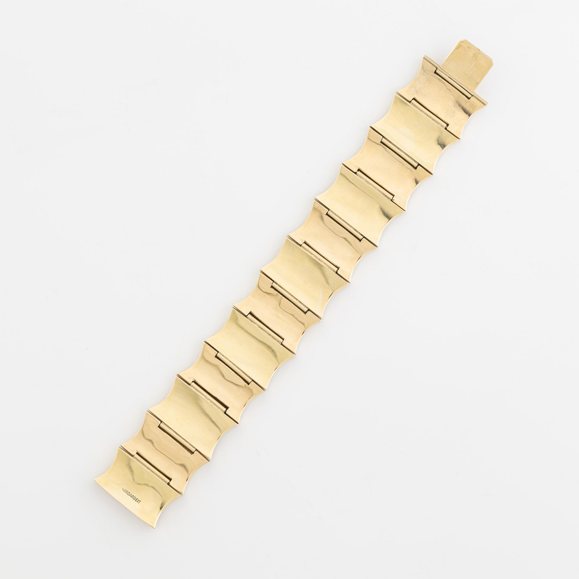 A 14K gold bracelet.