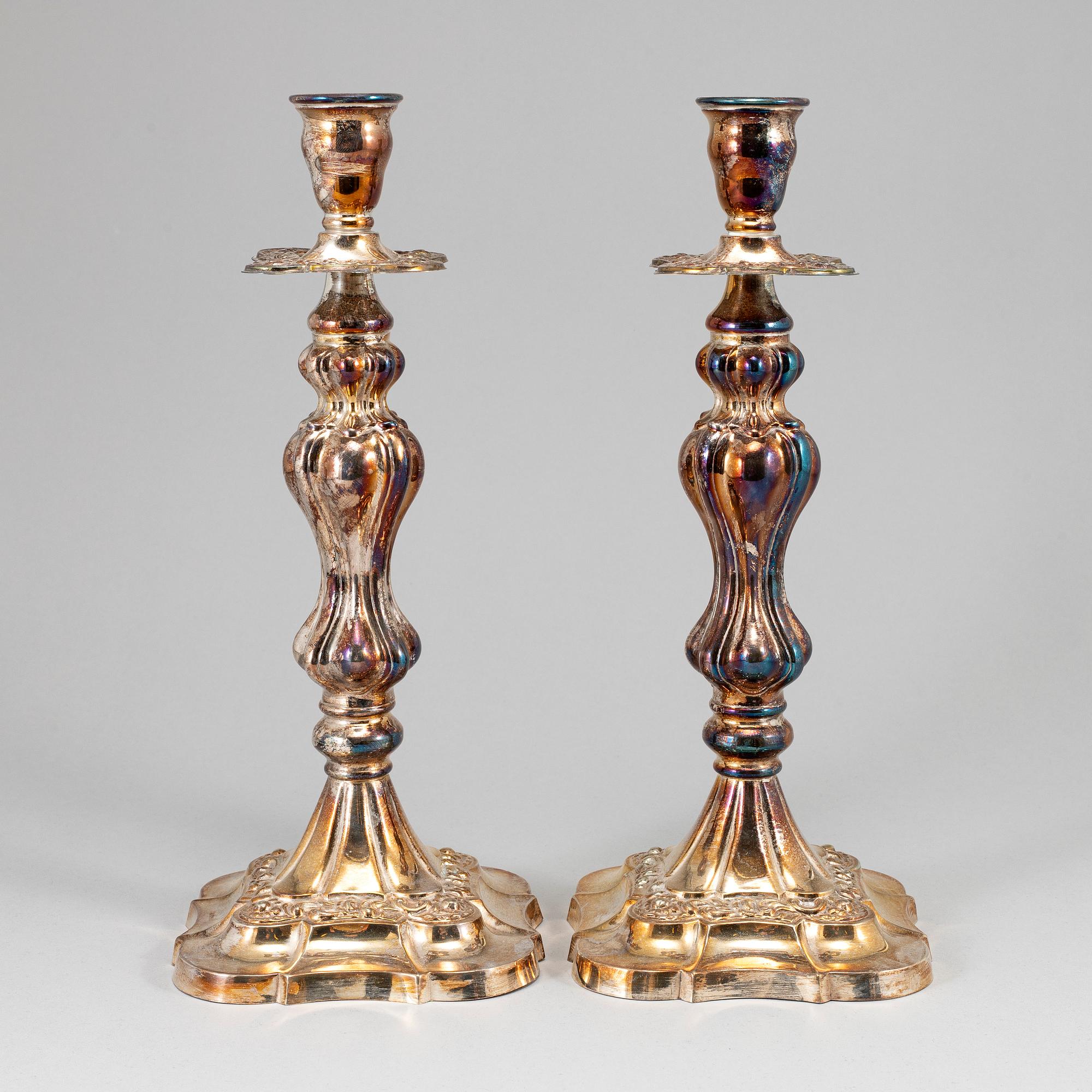 A pair of silver plated candlesticks.