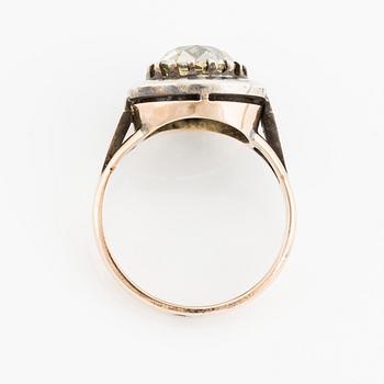 A 14K gold and silver ring with an old-cut diamond.