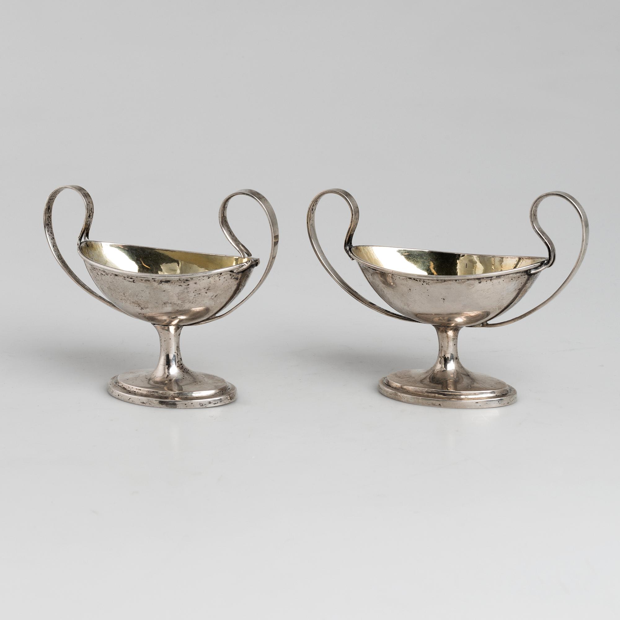 A pair of firt half of the 19th century parcel-gilt silver salt-cellars by an uknown master, one marked HB.