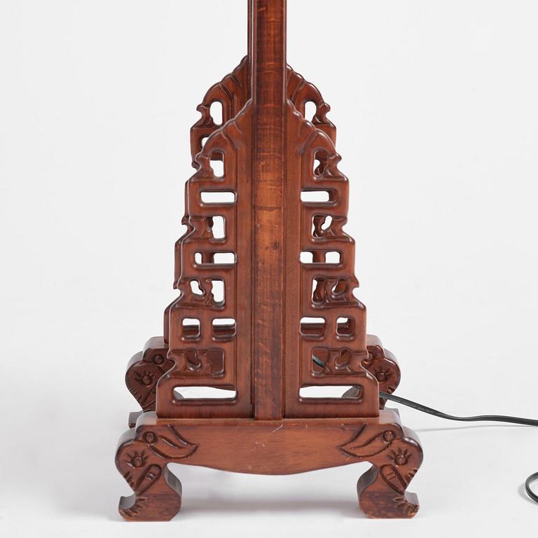 A Chinese wooden floor lamp, later part of the 20th century.
