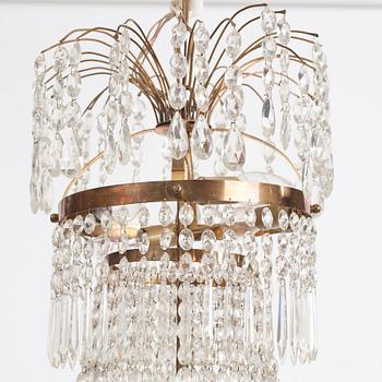 A gilt brass and cut glass nine-light Empire chandelier, first part of the 19th Century.
